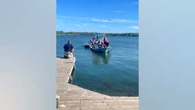 3 adults, 1 child rescued from lake after boat capsizes in Fayette County
