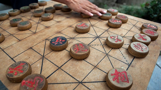 Chinese chess champ stripped of title, suspended for allegedly cheating, defecating in hotel bathtub