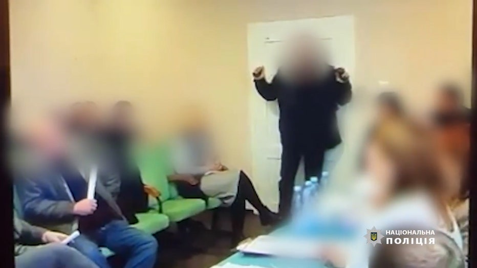 Video shows Ukrainian council member throw grenades at village meeting;  dozens injured