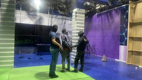 Armed men storm Ecuadorian TV studio, brandishing explosives and guns during live broadcast