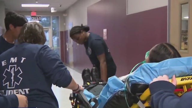 PfISD students getting hands-on firefighter and EMT training