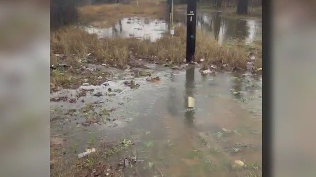 Family's backyard floods during heavy rain ever since 183 Toll was built