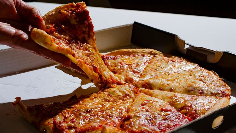 FILE - A file photo shows cheese pizza on Feb. 13, 2019. (Photo Illustration by Thomas Trutschel/Photothek via Getty Images)