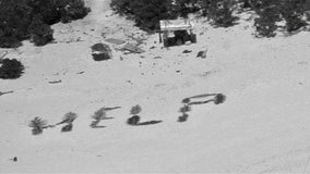 Castaways rescued from remote Pacific island after writing 'HELP' on beach in palm tree fronds