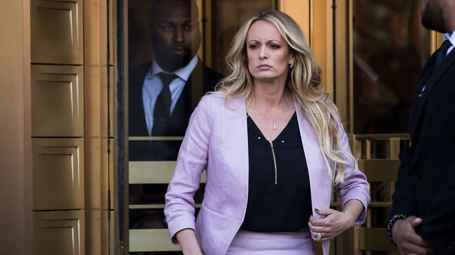 FILE - Adult film actress Stormy Daniels (Stephanie Clifford) exits the United States District Court Southern District of New York for a hearing related to Michael Cohen, President Trump's longtime personal attorney and confidante, April 16, 2018, in New York City. (Photo by Drew Angerer/Getty Images)