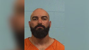 APD officer turns himself in on injury to a child charges