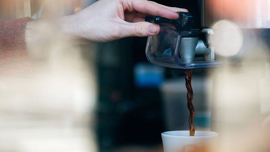 FILE - A barista pours a cup of coffee on Feb. 22, 2016, in the Brooklyn borough of New York City. (Photo by Bryan Thomas/Getty Images)