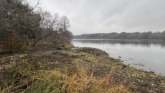 Broken gate at Longhorn Dam causes Lady Bird Lake Levels to drop, showing trash