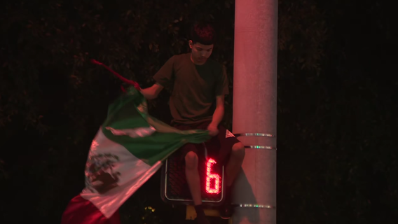 Large anti-ICE protest fills street in North Austin; 2 arrested by APD