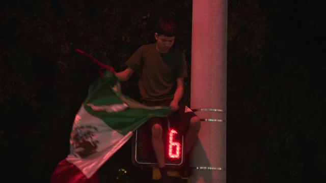 Large anti-ICE protest fills street in North Austin; 2 arrested by APD