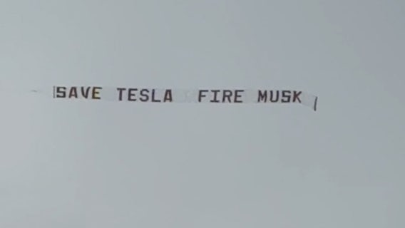 'Save Tesla Fire Musk' banner flies over downtown Austin