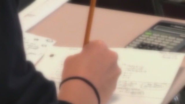 Abbott signs business bills as deal on education funding gets closer