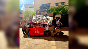 Texas State University students, staff rally in support of former professor