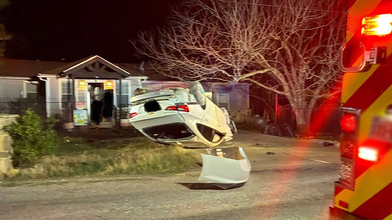 Car ends up overturned in front yard after pursuit in Mustang Ridge