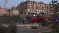 Truck gets wedged under overpass in downtown Austin