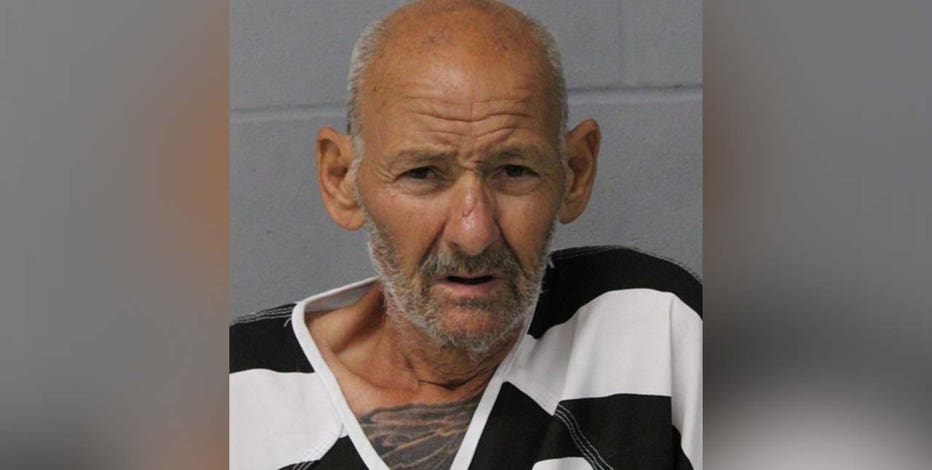 Man arrested in connection with body being found in trash can in South Austin