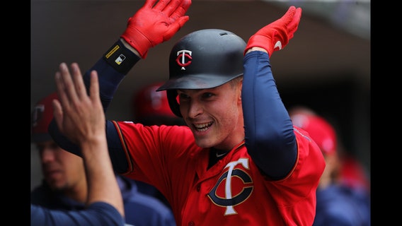 Twins slugging to division lead, 25 games in