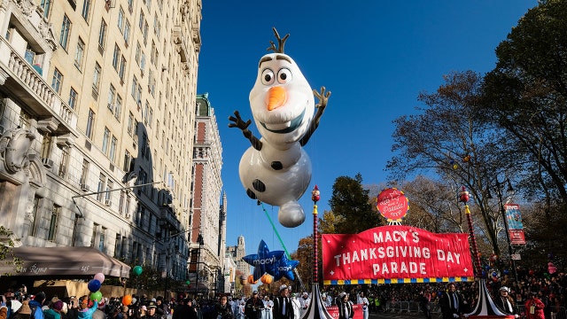 Macy's parade rolls on with balloons, bands, security