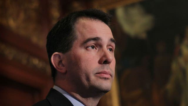 Gov. Walker signs lame-duck bills weakening powers of Democratic governor, AG