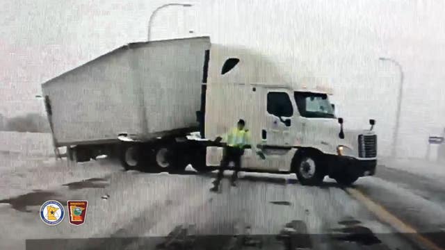 State Trooper fights wind, loses