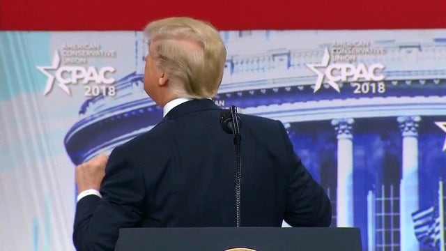 Trump says he goes to great lengths to hide his bald spot, conservative crowd cheers