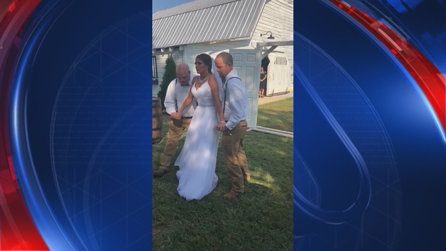 Paralyzed woman works three years to walk down the aisle at her wedding