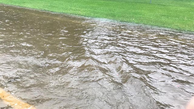 Heavy rains flood out streets in Sartell, Minn.