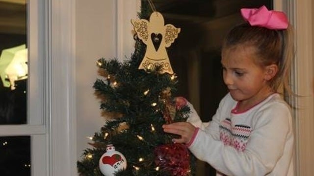 Young heart transplant recipient honors donor with Christmas ornaments