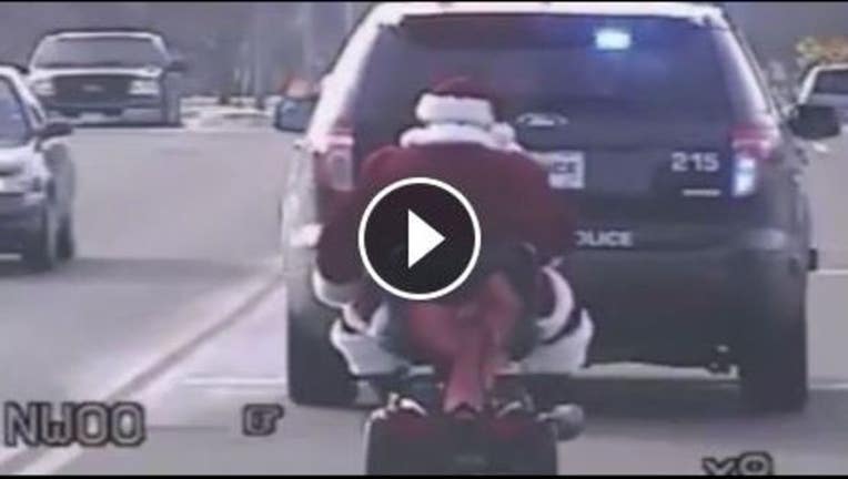 11d0301c-Santa on scooter_1449614269403.JPG