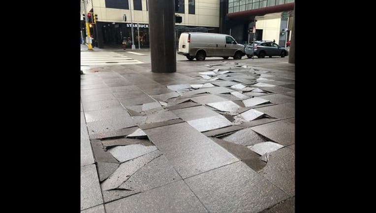 13aa2ea8-Fifth Street Towers damaged pavers