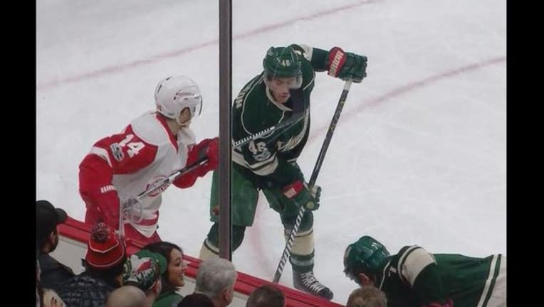 751f2c4b-Jared Spurgeon hit by Nyquist_1487200156078.JPG