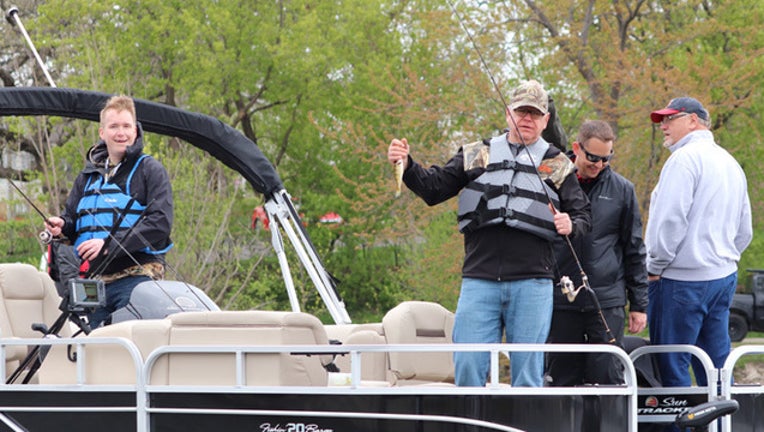 801622bf-Walz with a fish
