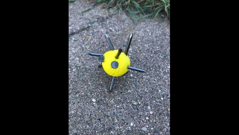 b366f2d7-golf ball with nails found in lakeville park_1497474238252.jpg