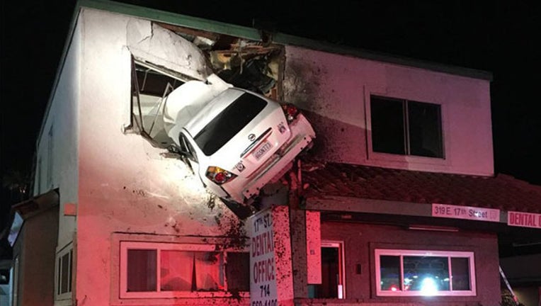 b9053c27-Car into second floor building