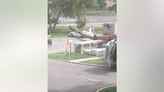 Construction crane falls on parked car at Bloomington, Minn. apartment complex