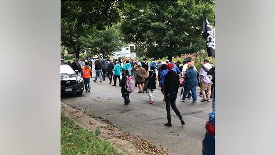Protesters march in Midway neighborhood after last week's officer-involved shooting in St. Paul, Minn.