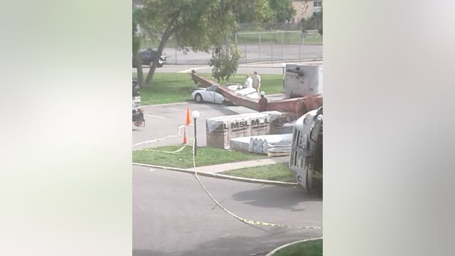 Construction crane falls on parked car at Bloomington, Minn. apartment complex