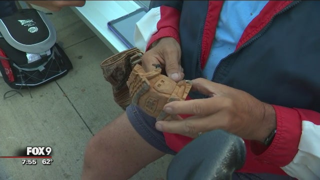 Reynold carves wooden house at Minnesota State Fair