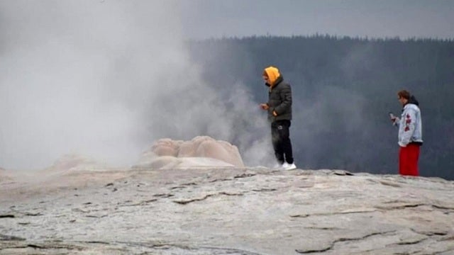 Tourists issued citations at Yellowstone National Park's Old Faithful for 'thermal trespassing'