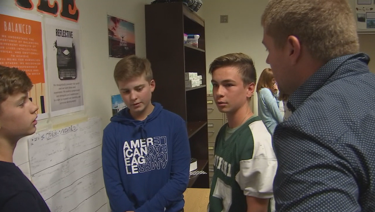 Rockford teacher speaks with students.