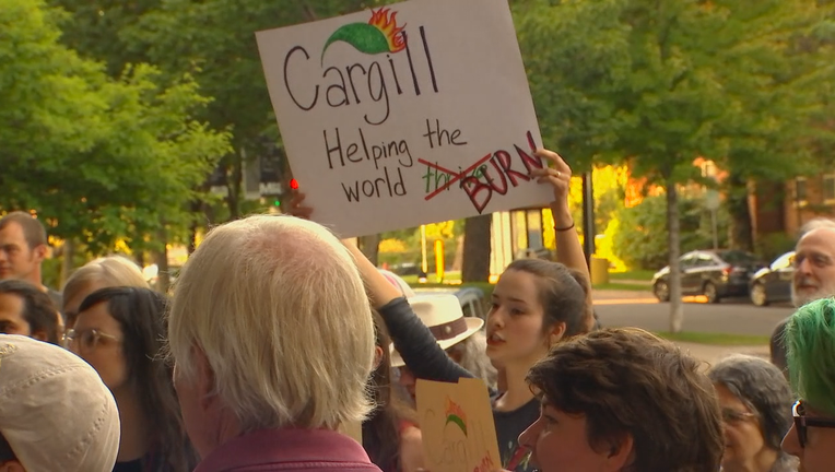 Protester holds sign reading