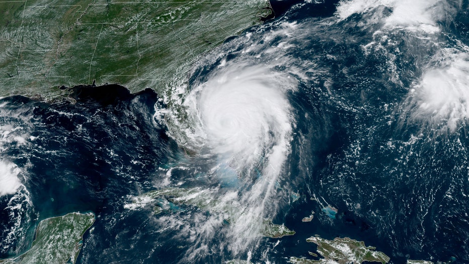 fbcf7e23-In this NOAA GOES-East satellite handout image, Hurricane Dorian, now a Cat. 2 storm, inches northwest away from the Bahamas on September 3, 2019 in the Atlantic Ocean. (Photo by NOAA via Getty Images)