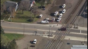 Man drives SUV through crossing gates, is struck by train in Clear Lake, Minn.
