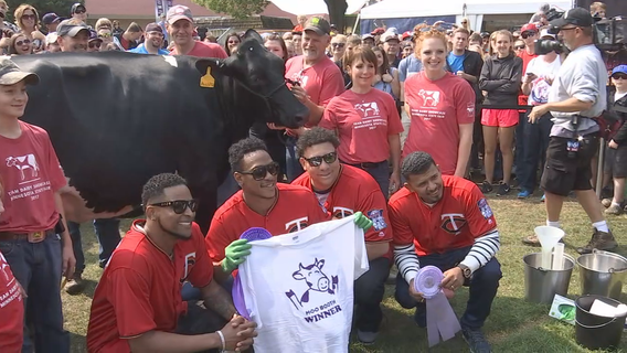 Twins trade mitts for milking gloves at State Fair