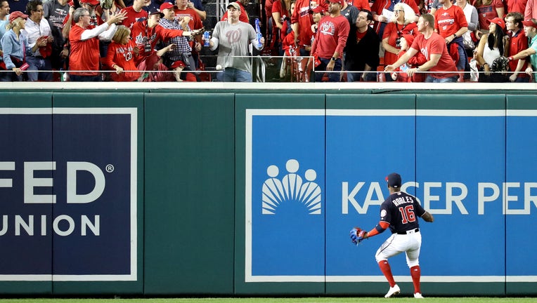 WASHINGTON, DC - OCTOBER 27: Victor Robles #16 of the Washington Nationals watches a two-run home run hit by Yordan Alvarez (not pictured) of the Houston Astros leave the park during the second inning in Game Five of the 2019 World Series at Nationals Park on October 27, 2019 in Washington, DC. (Photo by Rob Carr/Getty Images)