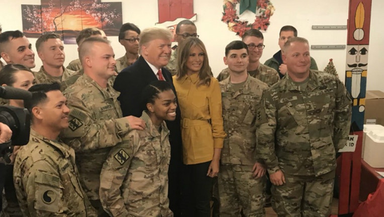 dc5bbbac-Trump visits Troops_Sarah Sanders_1545852617720.jpg.jpg