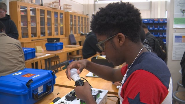 North Minneapolis students make solar-powered briefcase generators to help kids in Africa
