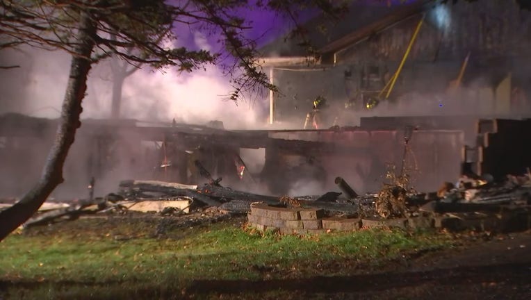 The charred remains of a Brooklyn Center home after a fire