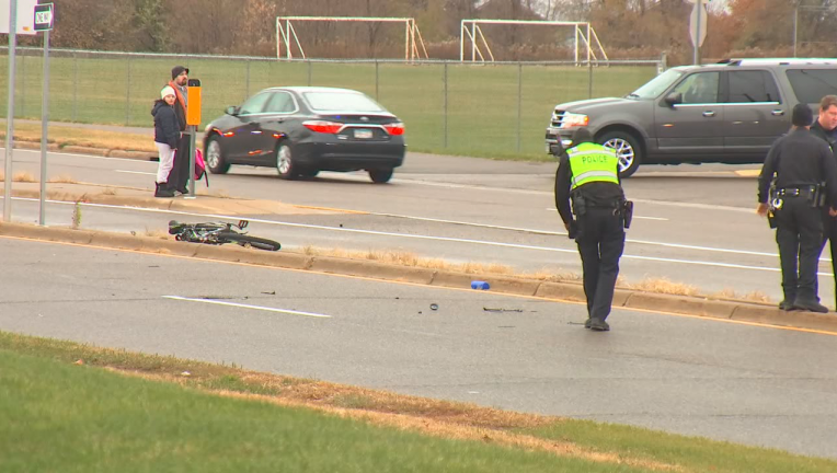 Investigators examine bike crash scene