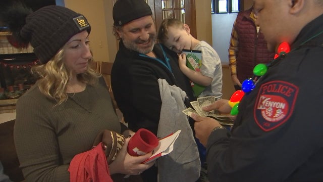 Kenyon, Minn. police officer plays Santa, surprising family with gifts after son's 3-year battle with leukemia